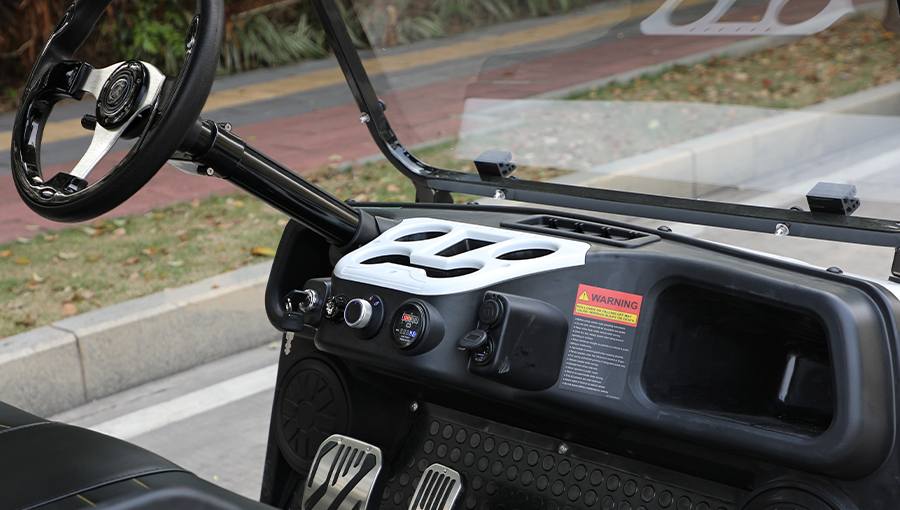 Dashboard of Tara electric utility task vehicle featuring digital speedometer, USB charging port, and control panel