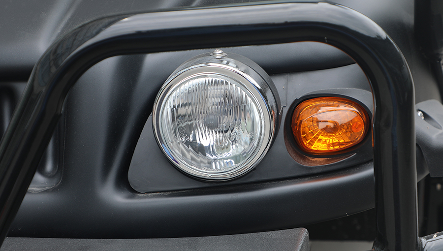 Close-up of LED headlights on Tara Turfman 700 EEC, providing clear and powerful illumination for safe night driving