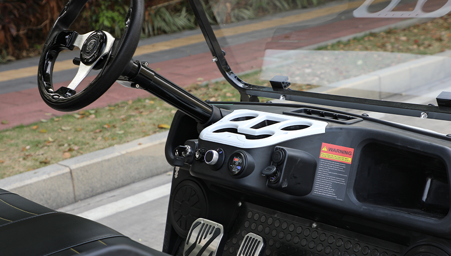 Close-up of Tara utility task vehicle dashboard featuring digital speedometer, battery indicator, and control switches