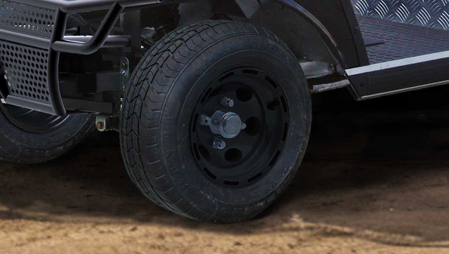 Standard road tread tire on Tara electric utility task vehicle, designed for quiet, stable, and comfortable ride on pavement
