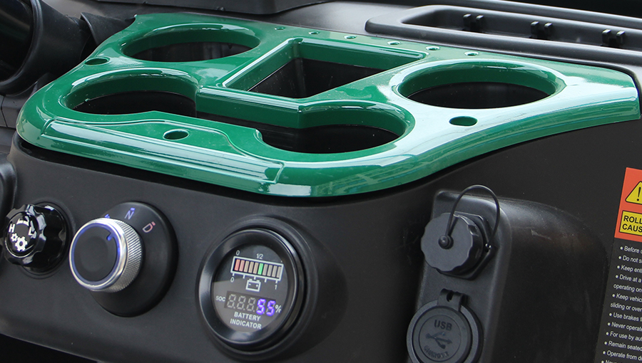 Close-up of Tara utility task vehicle cup holder designed to securely hold beverages during rides
